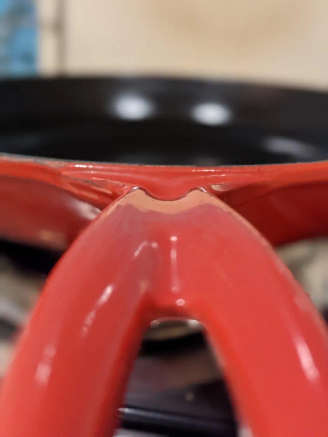 A glossy red curve in extreme close-up
